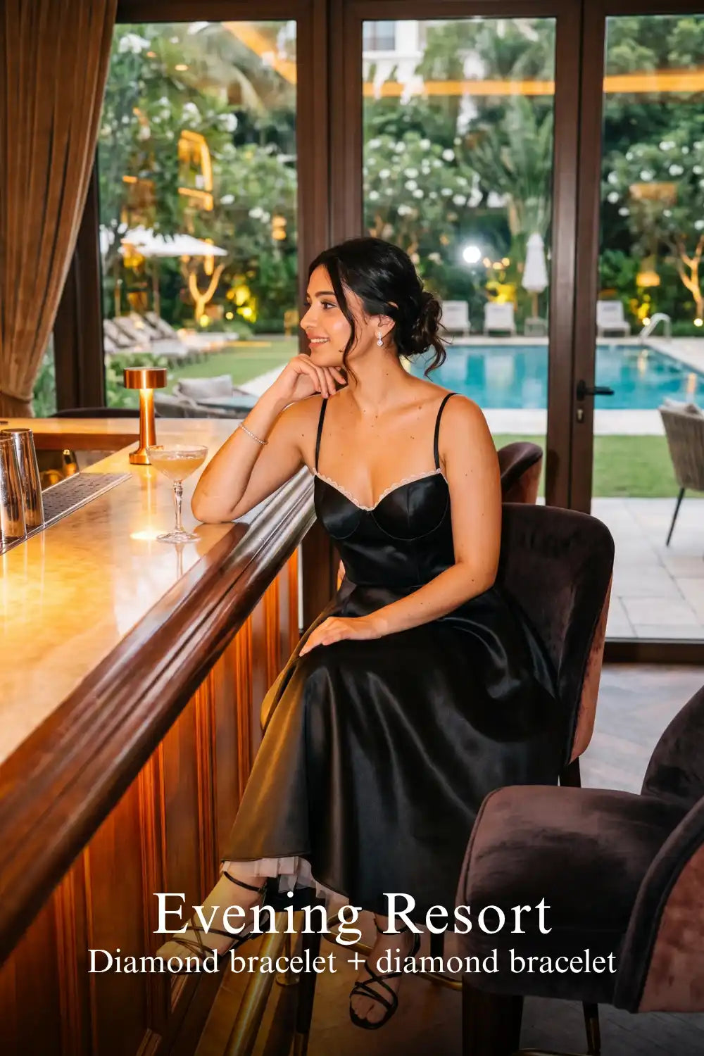Pretty Pixie black satin corset midi dress with tulle hem for evening resort.