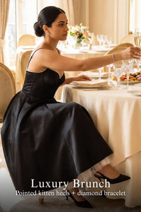 Pretty Pixie black satin corset midi dress with tulle hem for luxury brunch.