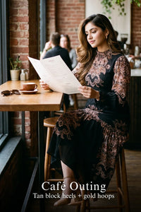 Woman in Pretty Pixie navy paisley kaitlyn tubular long-sleeve midi dress styled for a cafe outing