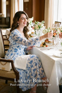 Woman in Pretty Pixie light blue toile floral ruffle v-neck midi dress styled for a luxury brunch 3