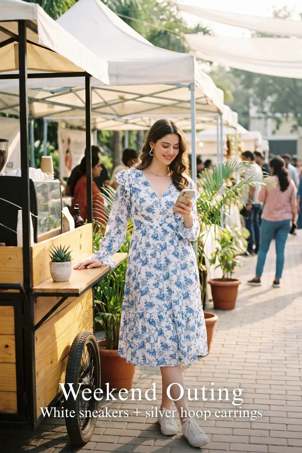 Woman in Pretty Pixie light blue toile floral ruffle v-neck midi dress styled for a weekend outing