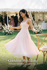Pretty Pixie blush pink lace-trim bustier strap midi dress for garden wedding.
