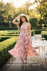Woman in Pretty Pixie blush pink pleated floral maxi dress styled for a luxury brunch