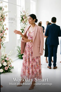 Woman in Pretty Pixie blush pink pleated floral maxi dress styled for a smart workday