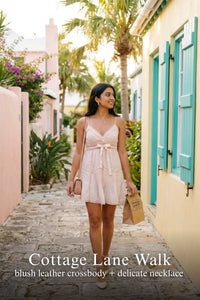 Pretty Pixie blush silk lace-trim pleated wrap dress for cottage lane walk.