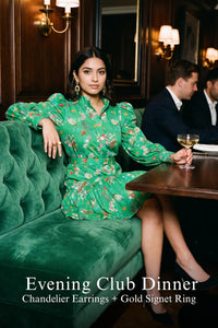 Woman in Pretty Pixie floral puff-sleeve smocked mini dress styled for an evening club dinner
