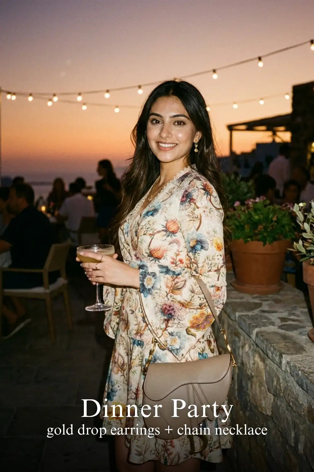 Woman in Pretty Pixie ivory floral wrap long-sleeve mini dress styled for a dinner party