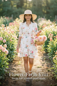 Woman in Pretty Pixie ivory floral dahlia belle tiered ruffle mini dress styled for a flower farm visit