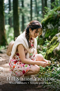 Woman in Pretty Pixie ivory rose print collared sleeveless mini dress styled for a hill station vacation