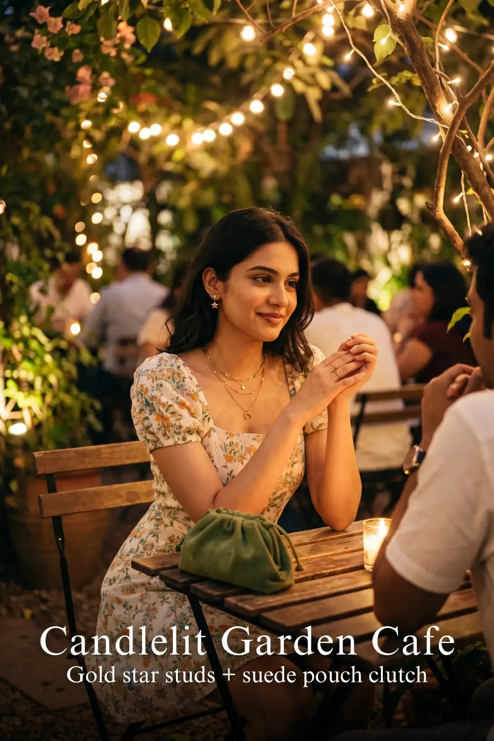 Woman in Pretty Pixie pastel floral puff-sleeve mini dress styled for a candlelit garden cafe