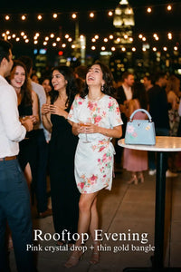 Woman in Pretty Pixie powder blue floral tie-waist mini dress styled for a rooftop evening