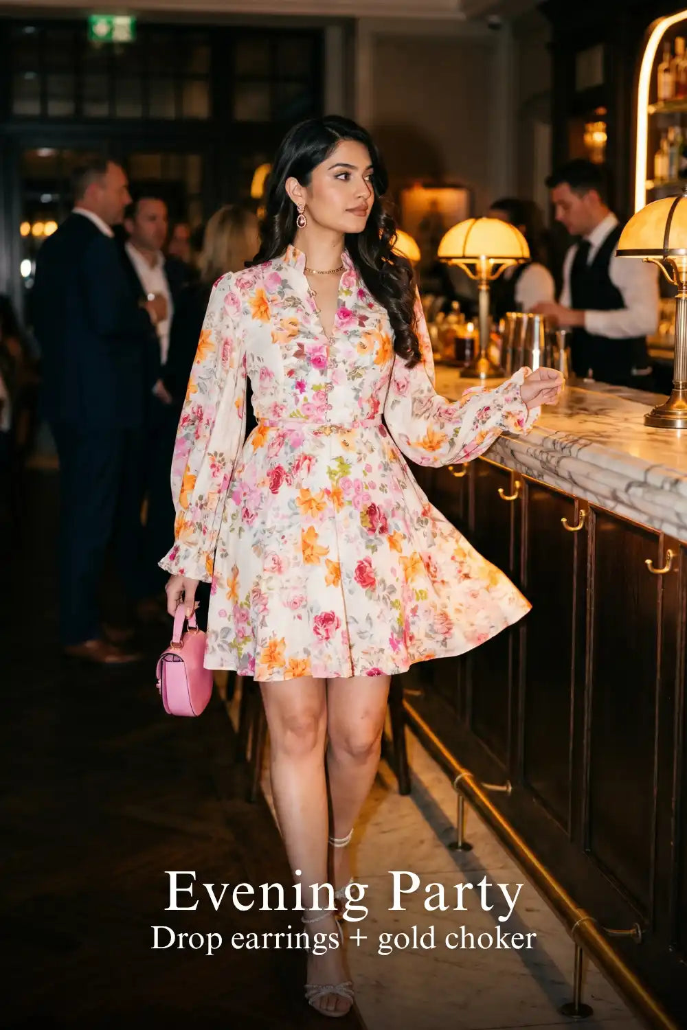 Woman in Pretty Pixie ivory floral long-sleeve button mini dress styled for an evening party