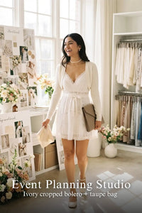 Pretty Pixie ivory silk lace-trim pleated wrap dress for event planning studio.