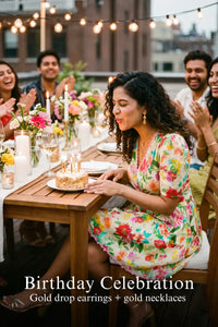 Woman in Pretty Pixie tropical floral puff-sleeve wrap mini dress styled for a birthday celebration 2