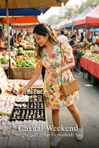 Woman in Pretty Pixie tropical floral puff-sleeve wrap mini dress styled for a casual weekend
