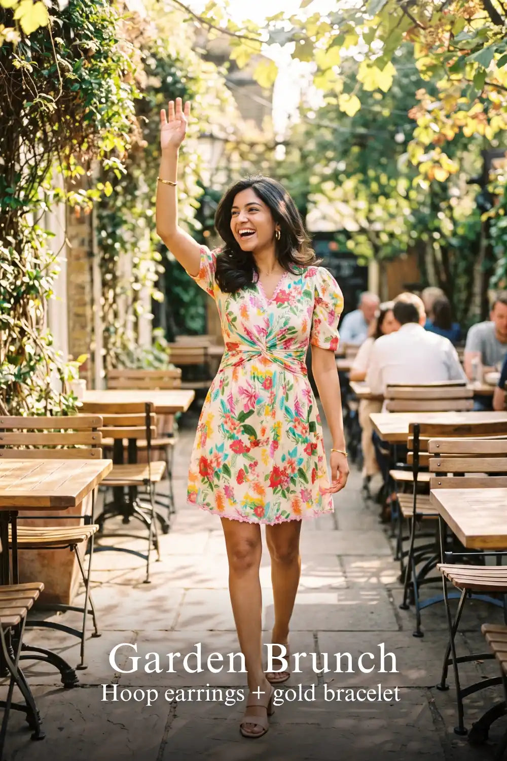 Woman in Pretty Pixie tropical floral puff-sleeve wrap mini dress styled for a garden brunch 2