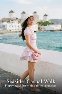 Pretty Pixie lilac eyelet ruffle mini dress for seaside casual walk.