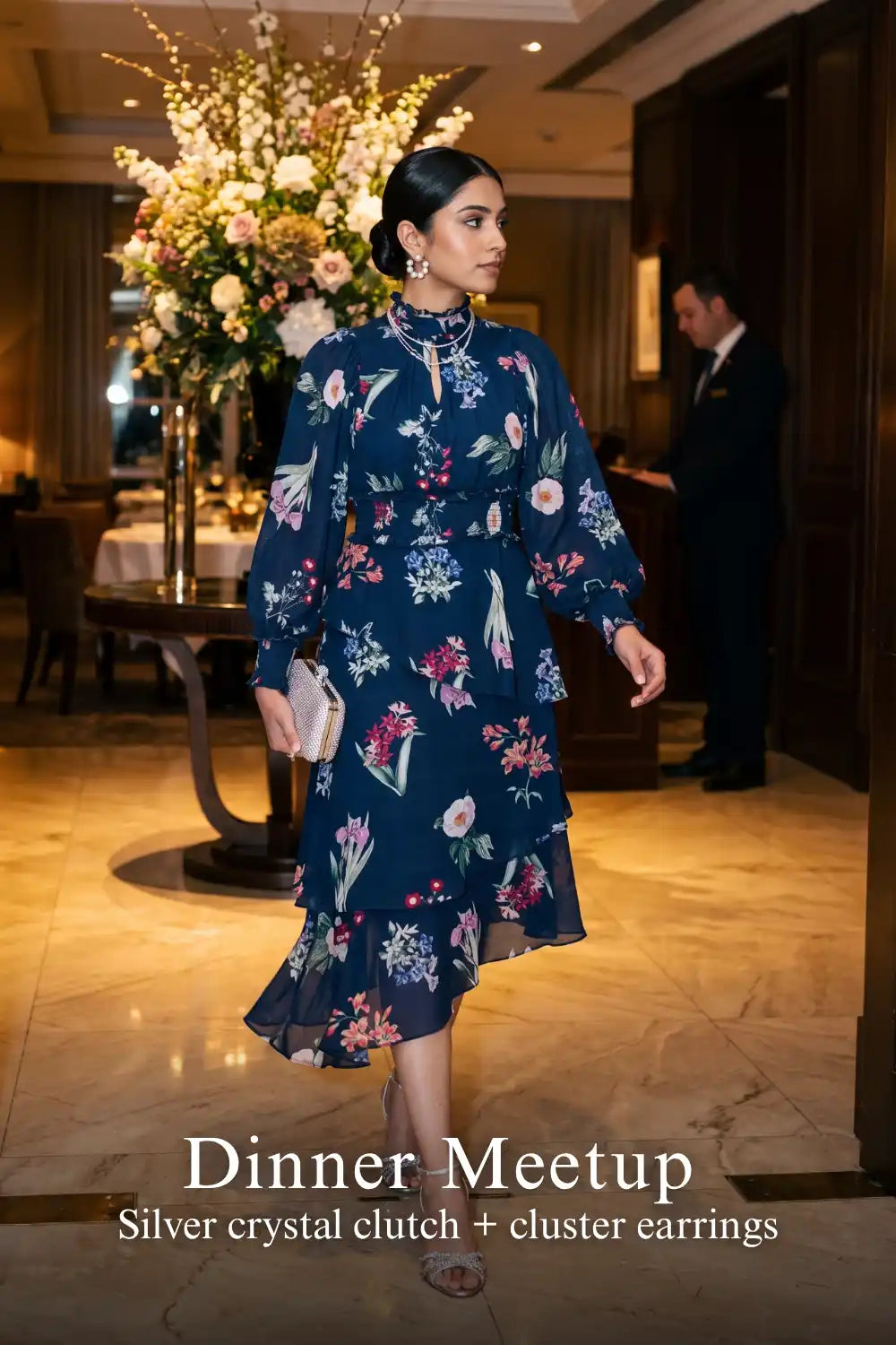 Woman in Pretty Pixie twilight rose navy floral ruffle hi-low midi dress styled for a dinner meetup