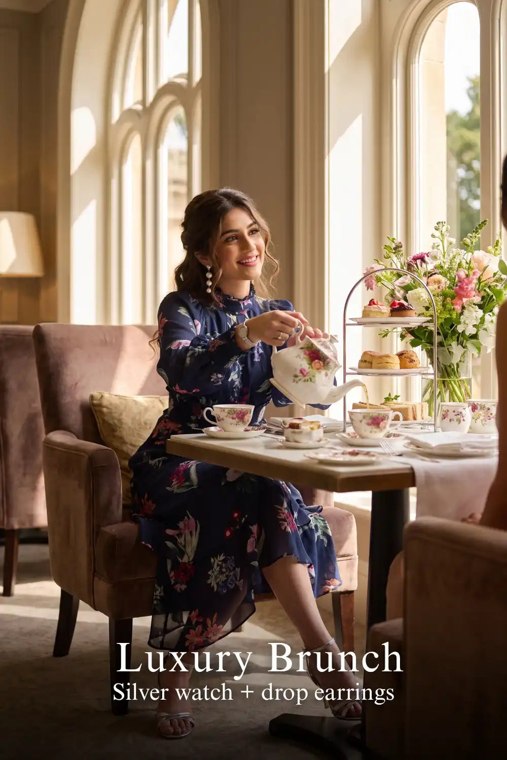 Woman in Pretty Pixie twilight rose navy floral ruffle hi-low midi dress styled for a luxury brunch