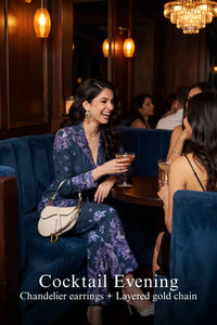 Woman in Pretty Pixie navy paisley belted blazer & flared pants co-ord set styled for a cocktail evening