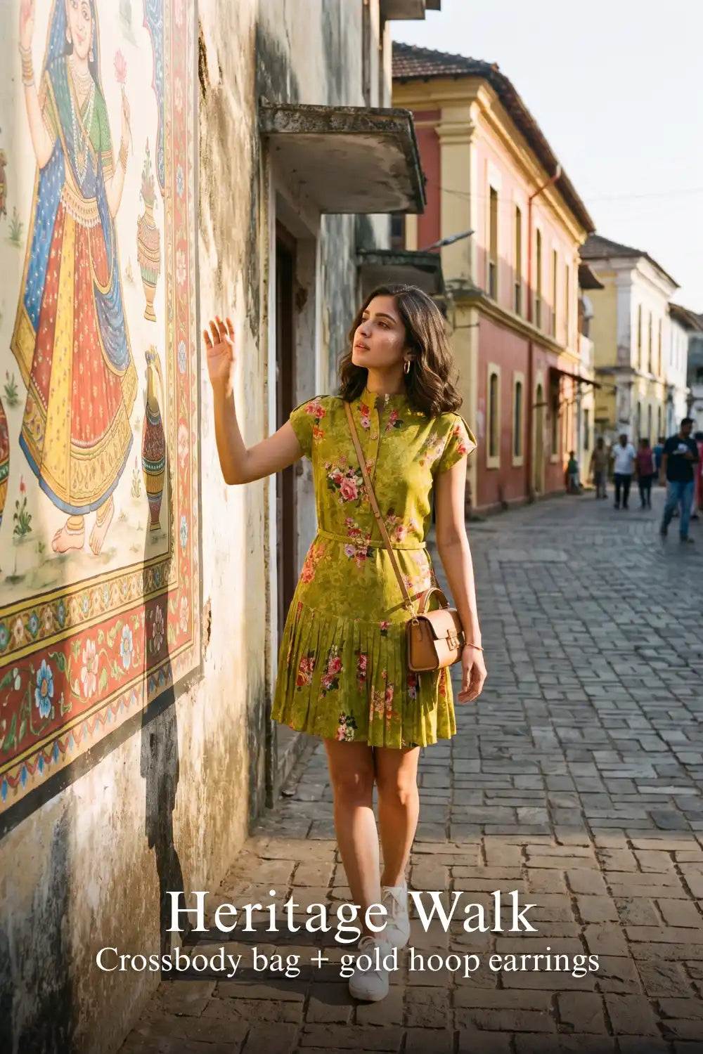 Woman in Pretty Pixie olive floral belted pleated shirt mini dress styled for a heritage walk