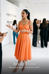 Pretty Pixie coral orange spaghetti strap bustier cotton dress for brand event.