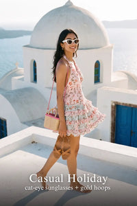 Pretty Pixie pastel pink floral halter mini dress for casual holiday.