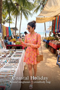 Pretty Pixie peach blossom floral belted long-sleeve mini dress styled for a coastal holiday