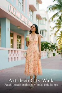 Pretty Pixie peach floral bow print halter v-neck dress for art deco city walk.