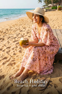 Woman in Pretty Pixie peach floral ruffle maxi dress styled for a beach holiday 2