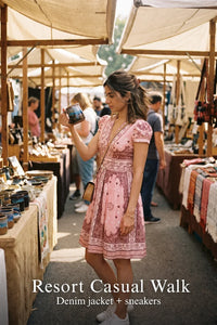Woman in Pretty Pixie pink bandana v-neck belted mini dress styled for a resort casual walk