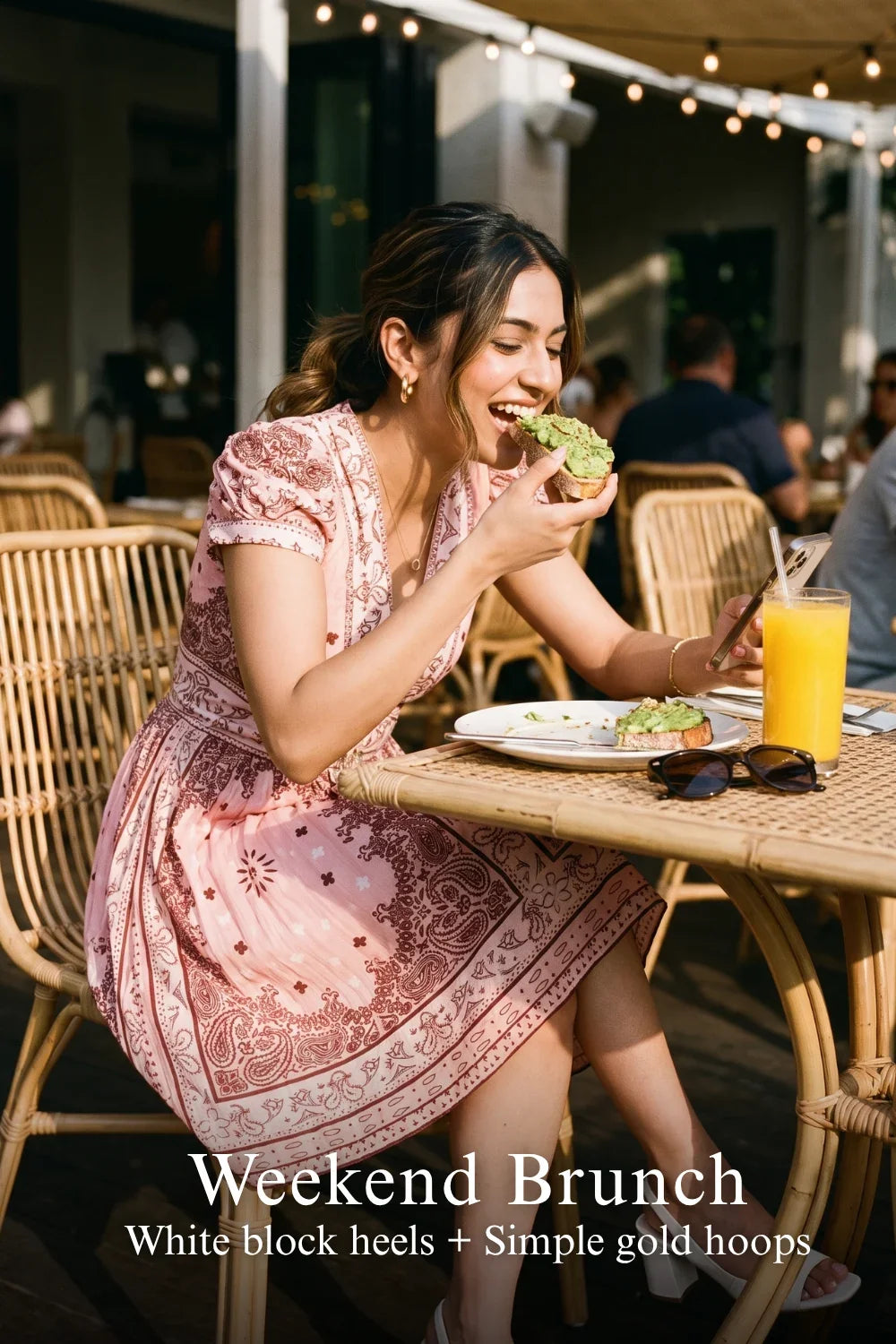 Woman in Pretty Pixie pink bandana v-neck belted mini dress styled for a weekend brunch