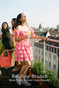 Pretty Pixie pink eyelet ruffle mini dress for rooftop brunch.