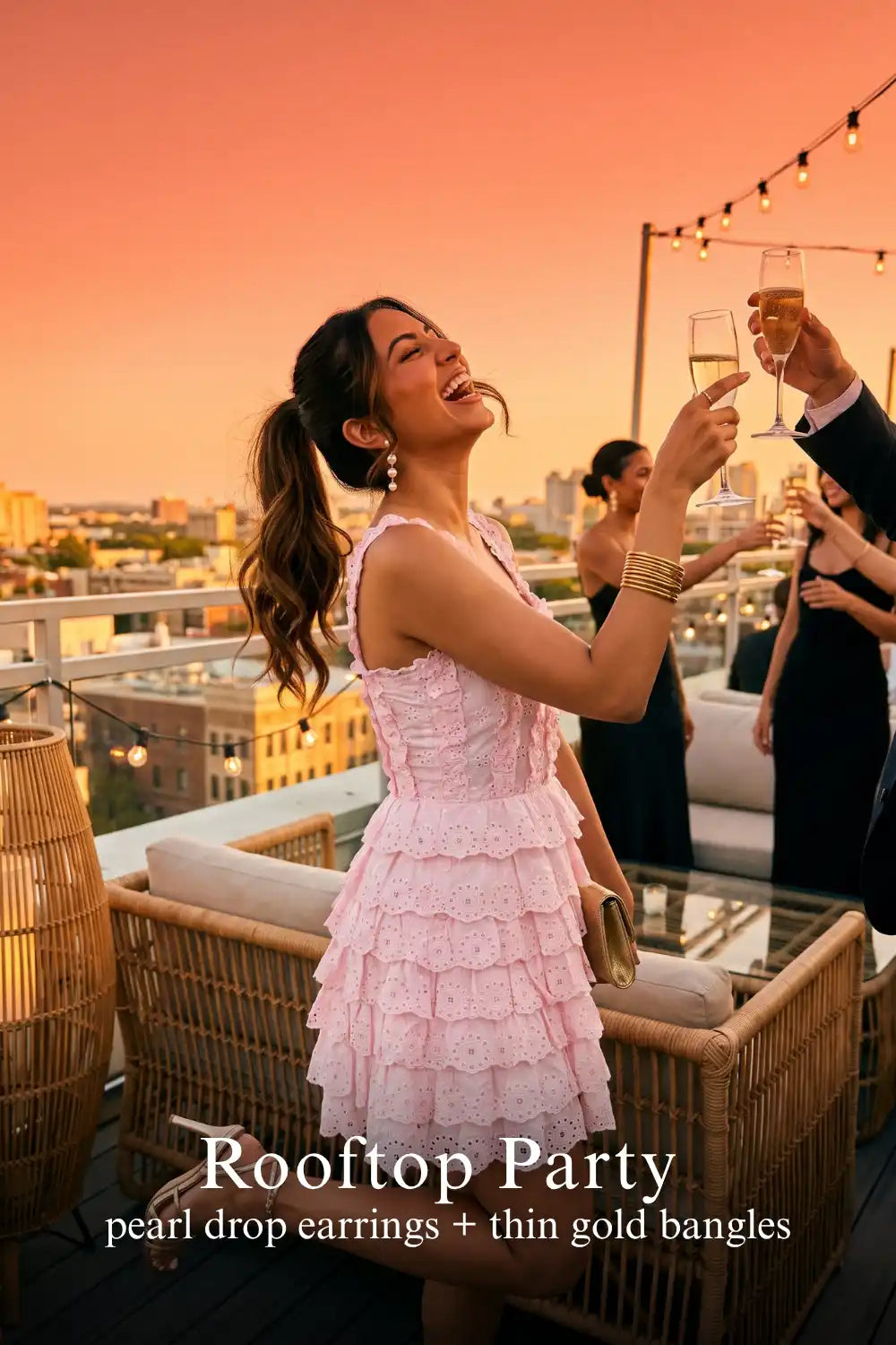 Pretty Pixie blush pink eyelet tiered ruffle corset dress for rooftop party.