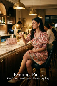 Woman in Pretty Pixie pink floral puff-sleeve belted mini dress styled for an evening party