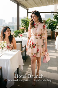 Woman in Pretty Pixie blush floral belted puff-sleeve mini dress styled for a hotel brunch