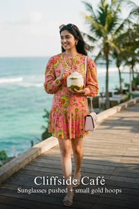 Pretty Pixie paradise pink floral puff-sleeve belted mini dress styled for a cliffside cafe