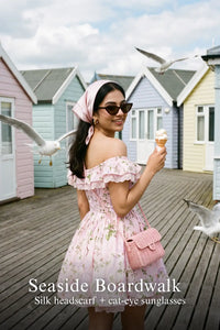Pretty Pixie pink floral lace-trim off-shoulder dress for seaside boardwalk.