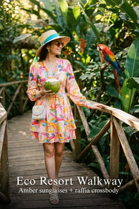 Pretty Pixie vibrant floral ruffled v-neck mini dress for eco resort walkway.