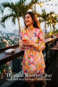 Pretty Pixie vibrant floral ruffled v-neck mini dress for tropical rooftop bar.