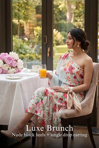 Woman in Pretty Pixie powder blue one-shoulder floral ruffle midi dress styled for a luxe brunch