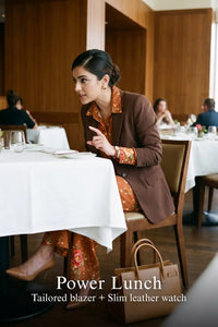 Woman in Pretty Pixie rust floral belted shirt & flare pants co-ord set styled for a power lunch