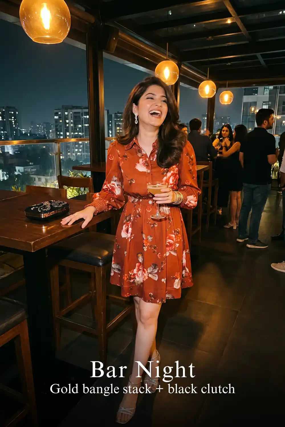 Woman in Pretty Pixie rust red floral button-down belted long sleeve mini dress styled for a bar night