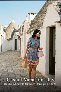 Pretty Pixie blue floral puff-sleeve belted mini dress styled for a casual vacation day