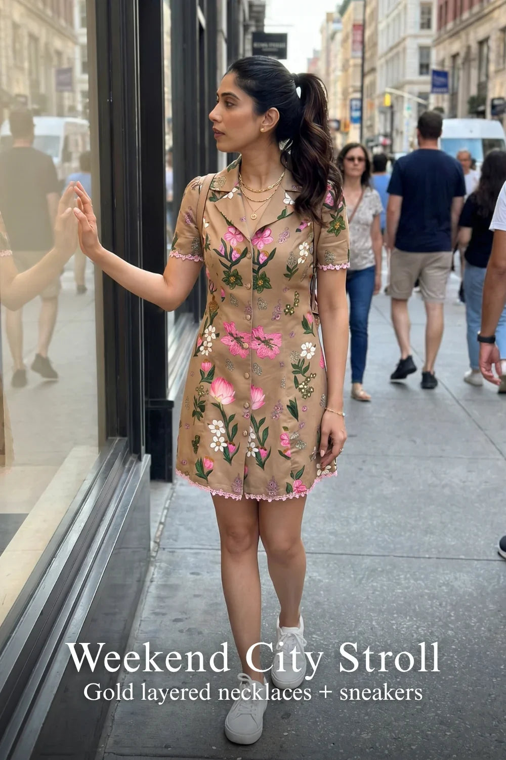 Woman in Pretty Pixie tan floral button-front mini dress styled for a weekend city stroll
