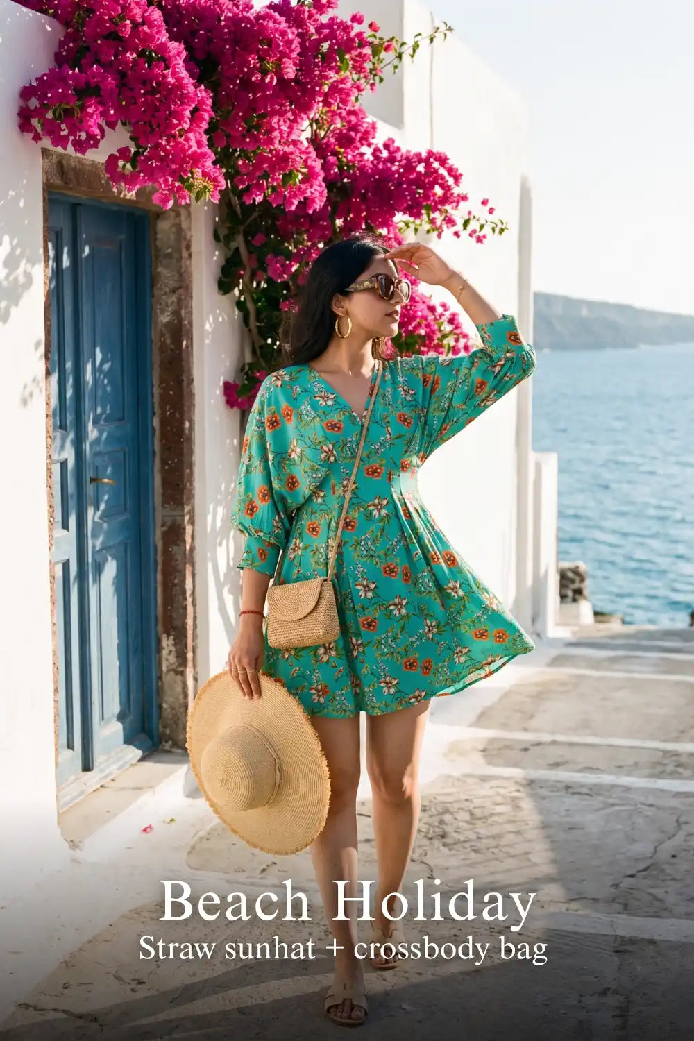 Woman in Pretty Pixie turquoise floral puff-sleeve belted mini dress styled for a beach holiday 4