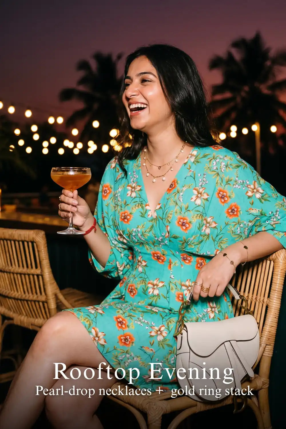 Woman in Pretty Pixie turquoise floral puff-sleeve belted mini dress styled for a rooftop evening 2