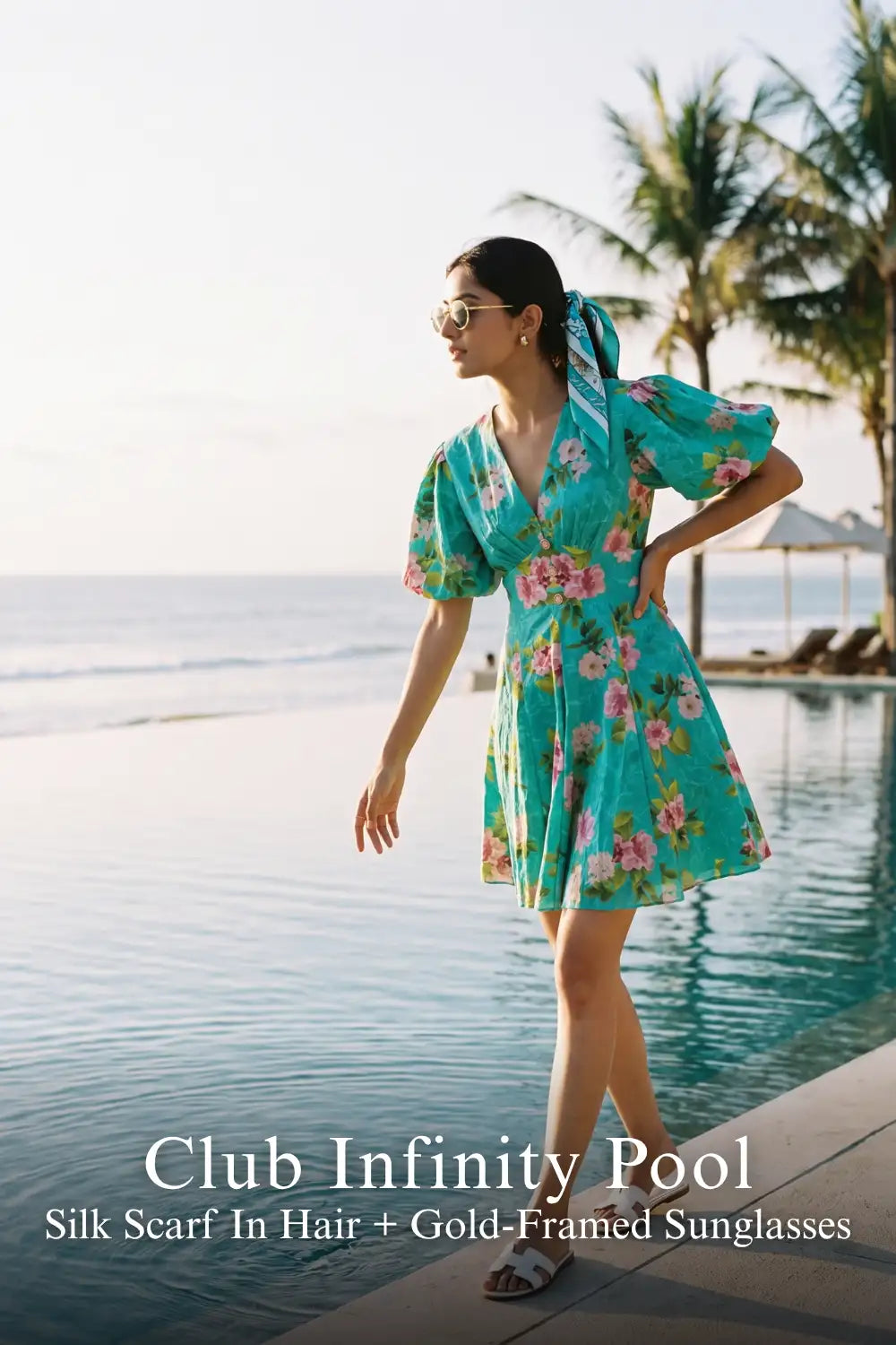 Pretty Pixie teal floral puff-sleeve mini dress for club infinity pool.