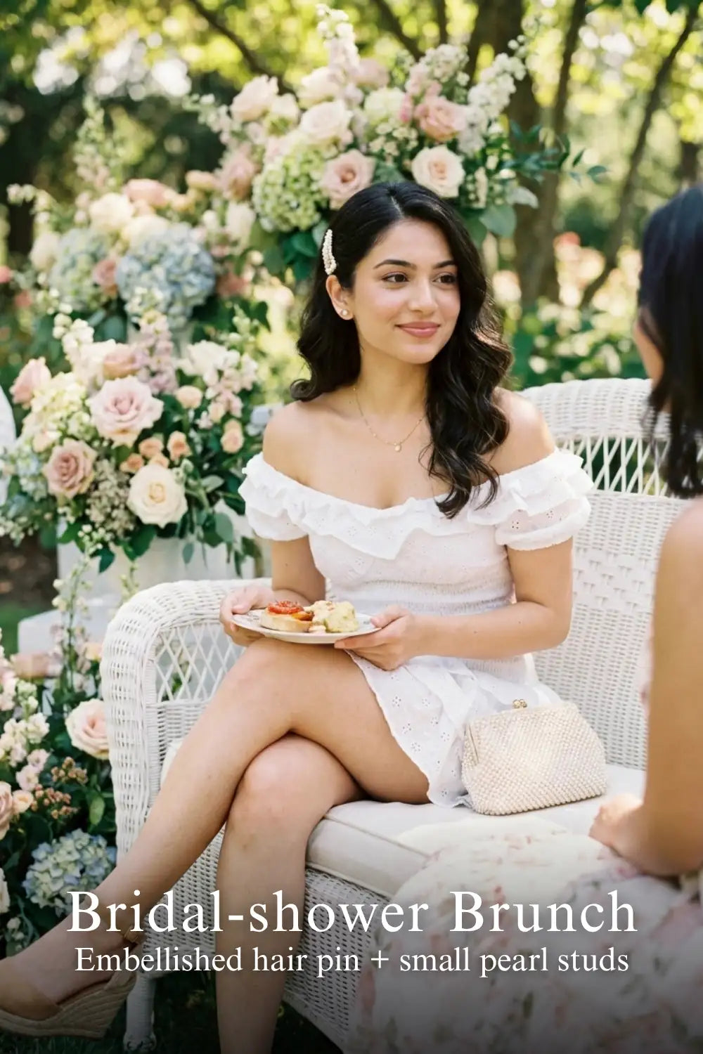 Woman in Pretty Pixie white eyelet ruffle mini dress styled for a bridal shower brunch