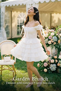 Pretty Pixie white cotton tiered ruffle eyelet mini dress for garden brunch.